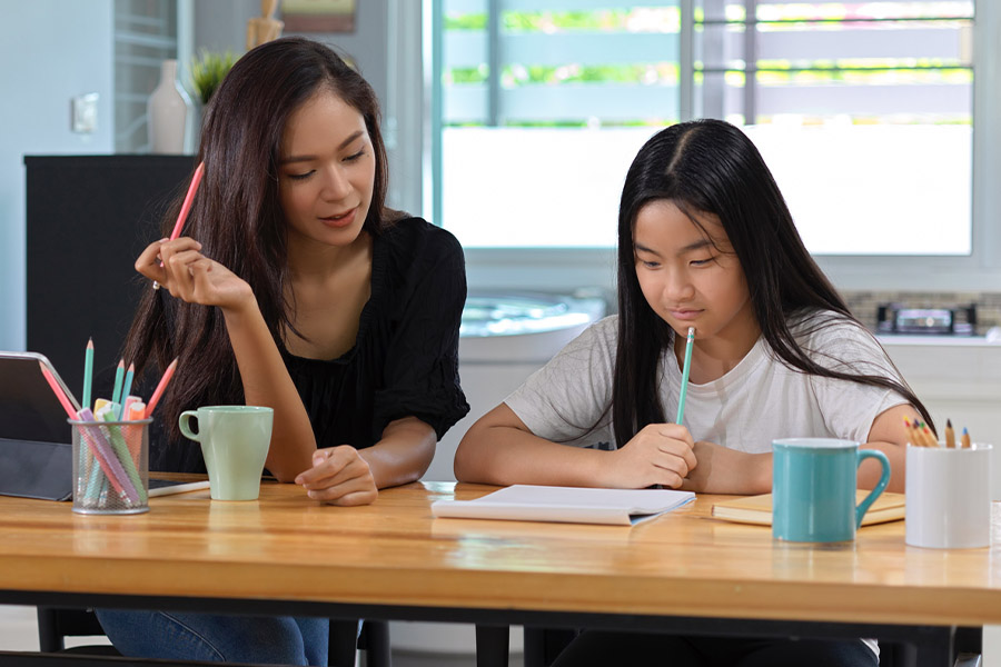 student and tutor together at a desk in Irvine